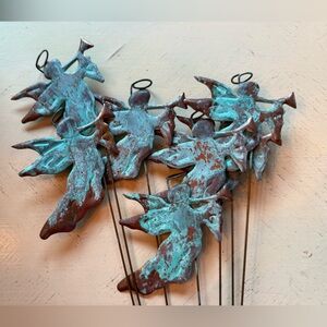 Winged Angel Holding A Trumpet, Made Of copper, With patina, With thin metal rod